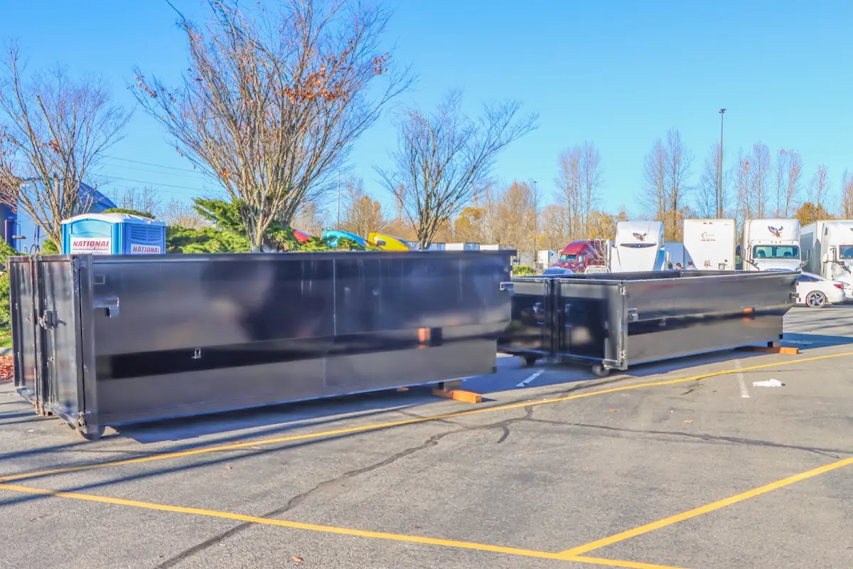 Professional dumpster rental service with roll-off container on residential driveway in Tiburon